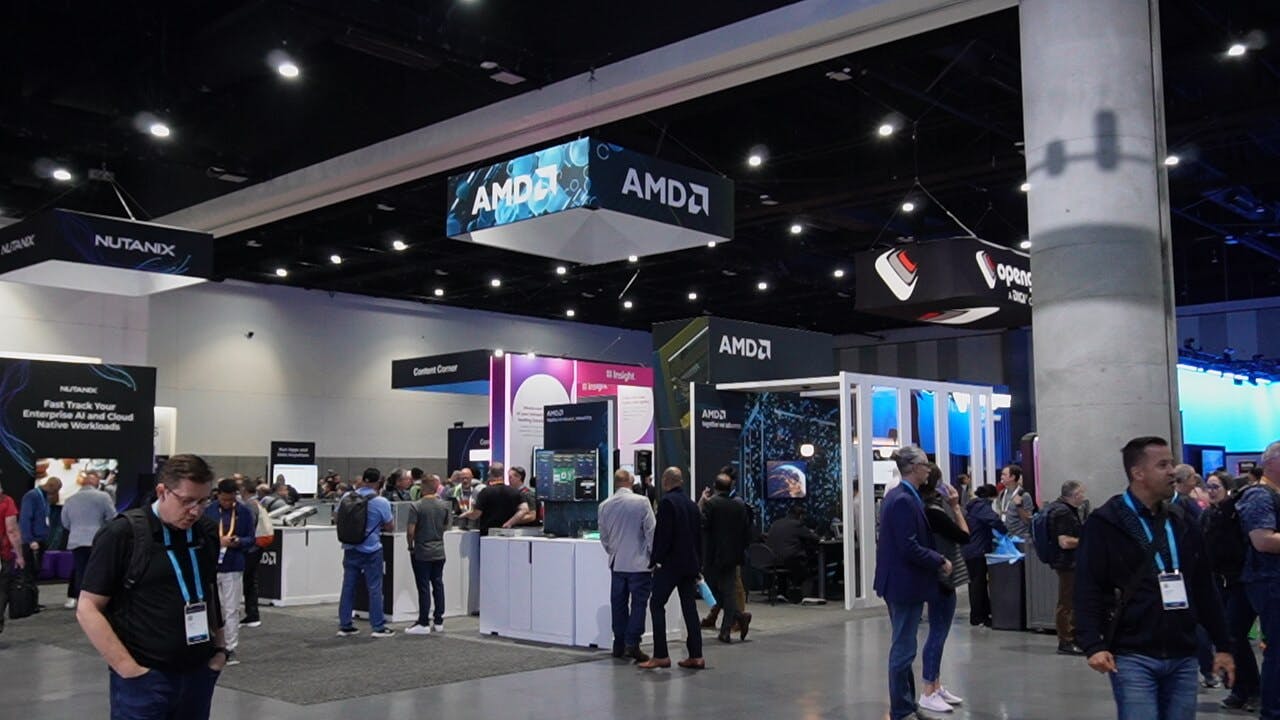Cisco Live booth visitors engaging with gamified AMD networking technology exploration